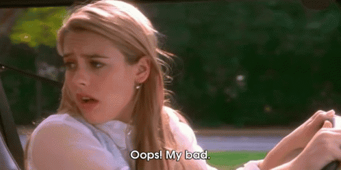 A GIF of an actress from the movie Clueless in a car, looking surprised and saying, 'Oops! My bad.'