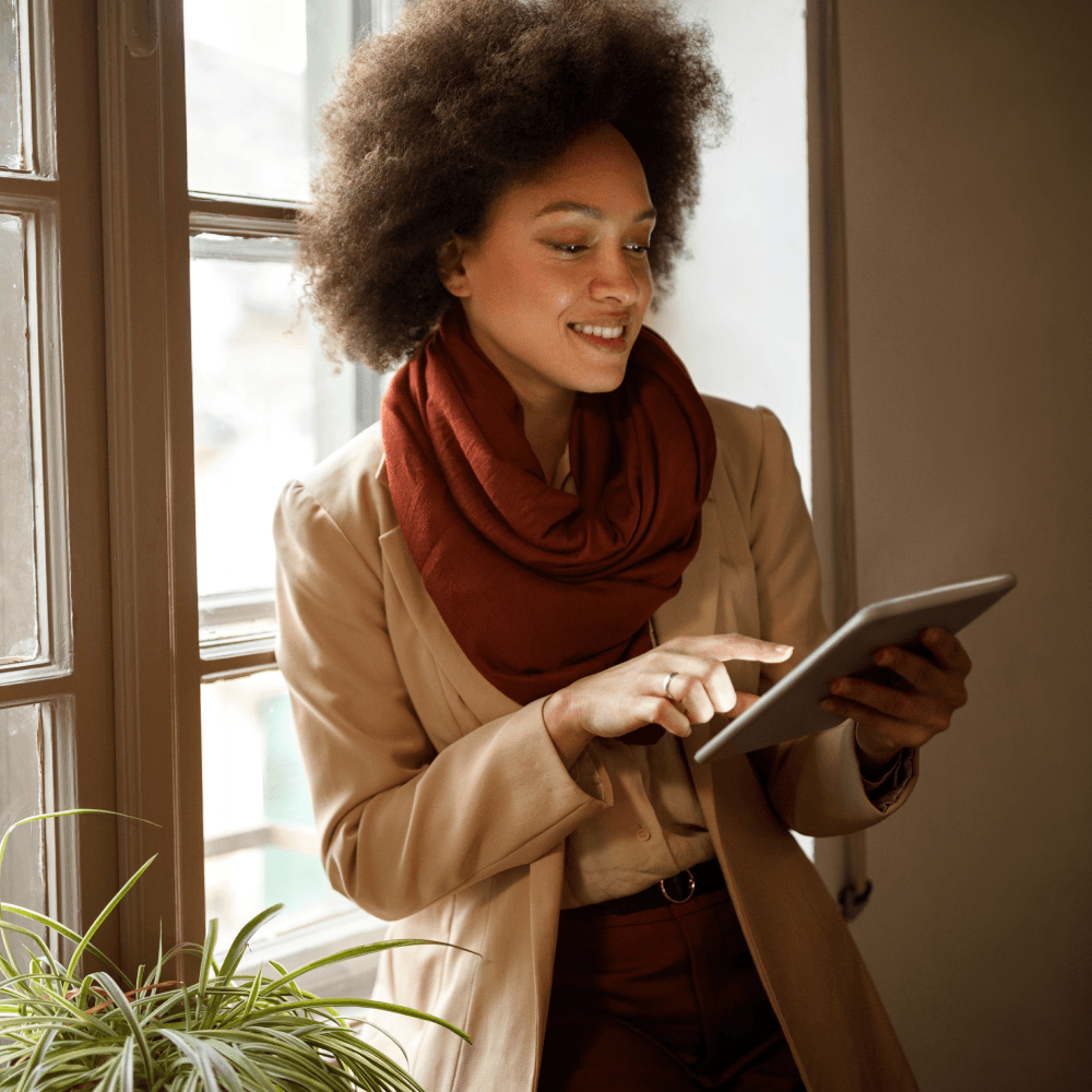 An single person in business professional clothing using a tablet.
