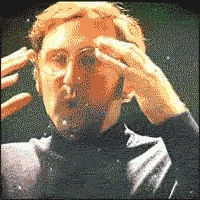 Gif of a man miming a brain explosion due to new information.